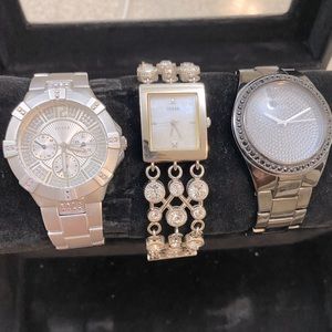 Three women’s Guess watches for sale.